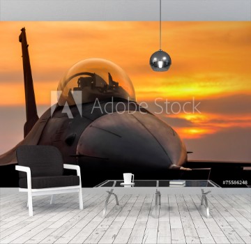 Picture of f16 falcon fighter jet on sunset background
